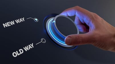 Hand turning a dial from 'Old Way' to 'New Way', representing a shift in approach, mindset, or strategy.