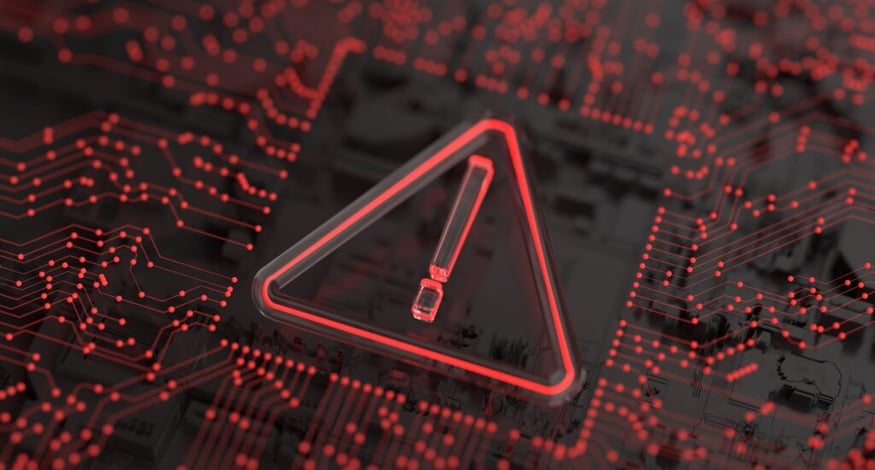 A glowing red warning triangle with an exclamation mark overlayed on a dark, abstract circuit board
