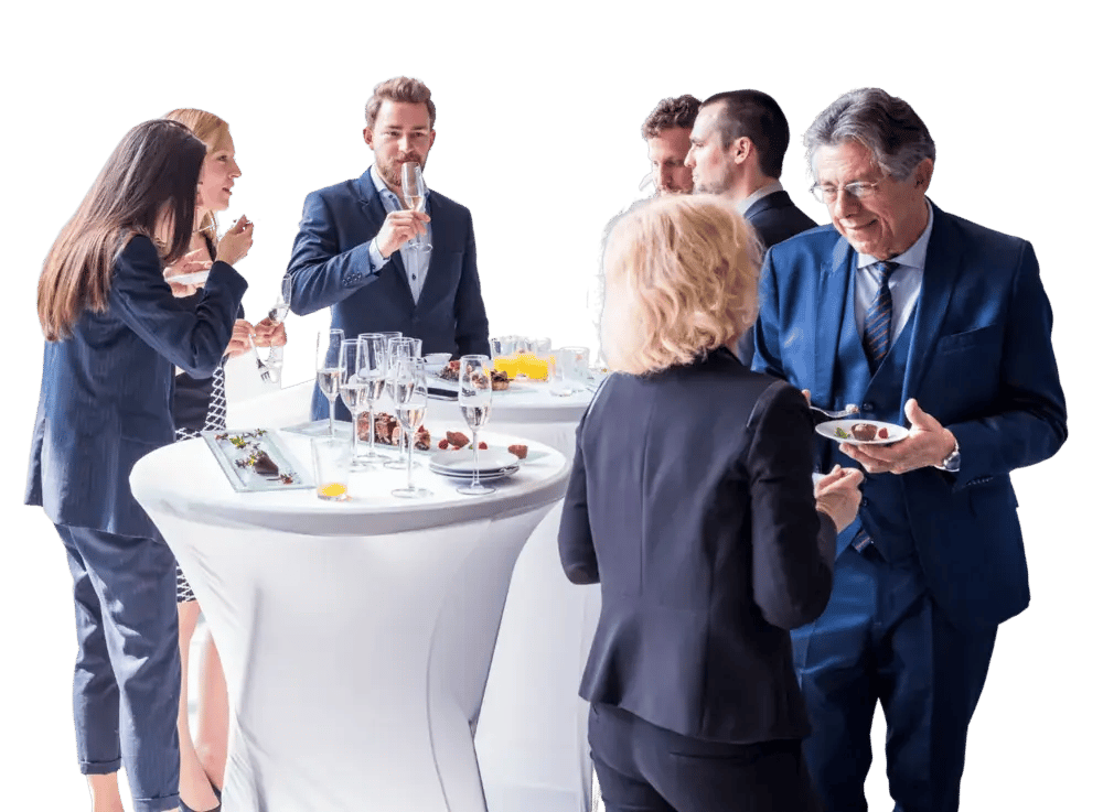 people mingling around high top tables at an event