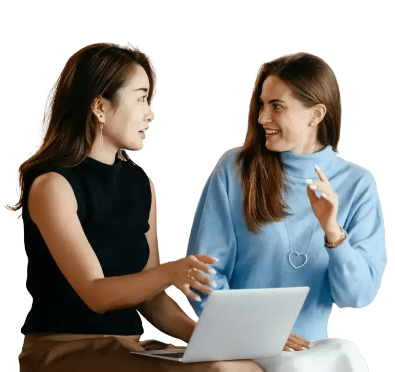 two professional individuals discussing something from a laptop